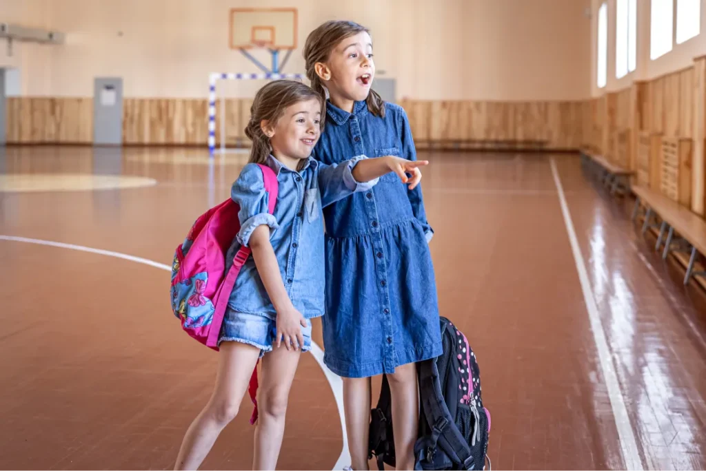 little_girls_elementary_schoolgirls_with_backpacks_after_school_school_gym_1